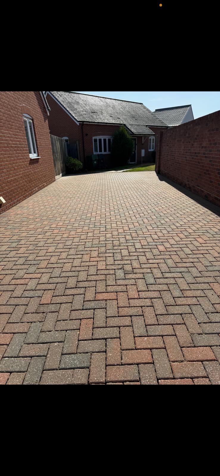 Driveway transformed after pressure washing